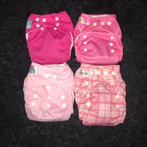 4 pink cloth diapers.